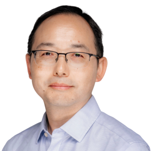 A man with short dark hair, glasses, and a light blue collared shirt is looking at the camera with a neutral expression against a plain white background. EFESO Management Consultants